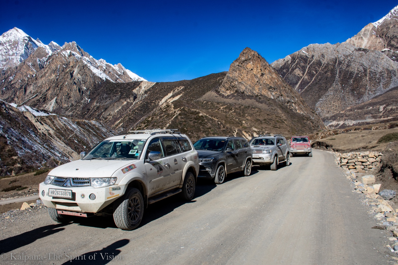 Expedition vehicles ascending spectacular hairpin bends