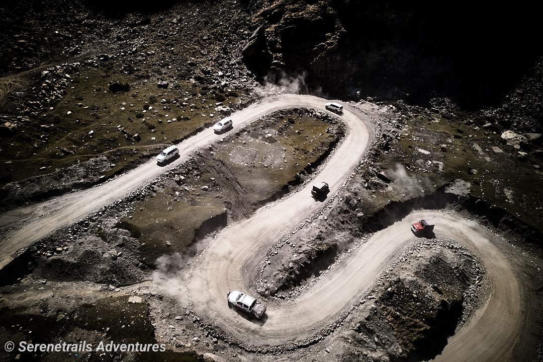 High-altitude valley road with majestic mountains